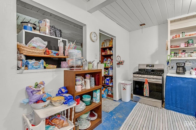 kitchen with beam ceiling, concrete floors, wooden ceiling, and stainless steel gas range