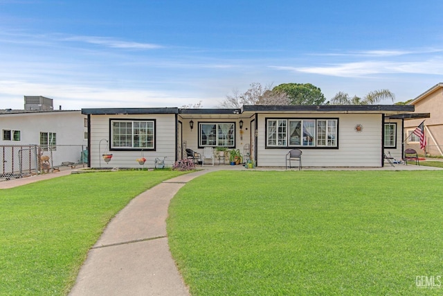 ranch-style home featuring a front yard