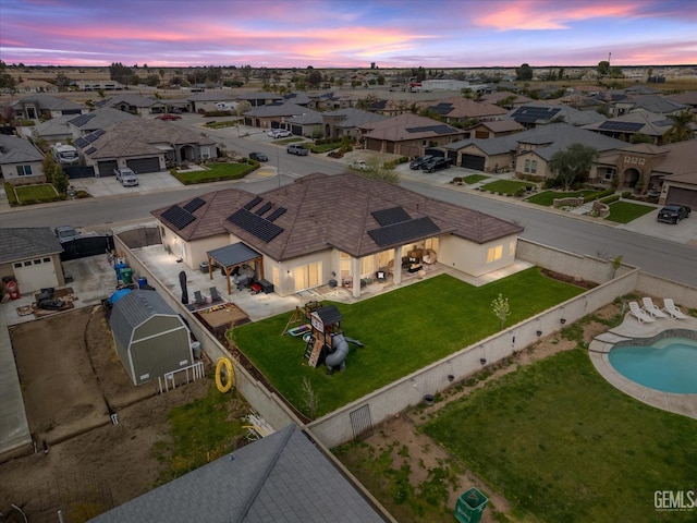 aerial view at dusk with a residential view