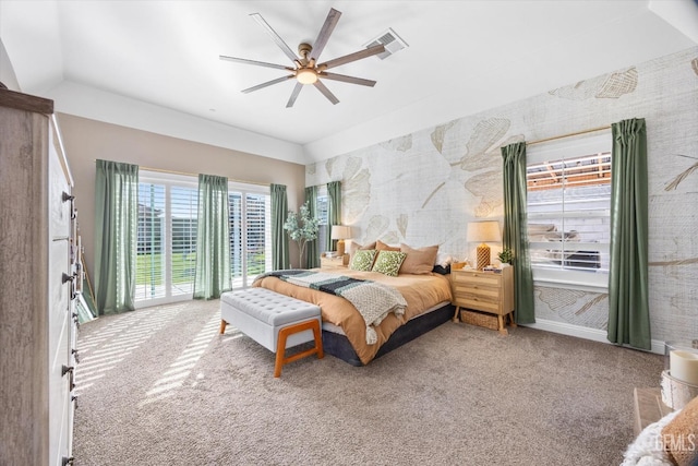 bedroom with wallpapered walls, a ceiling fan, visible vents, and carpet flooring