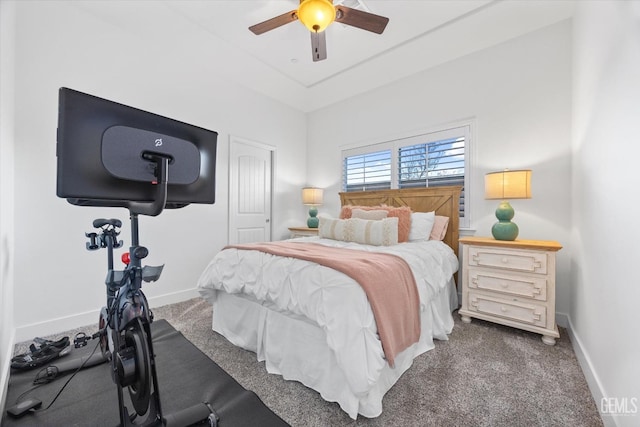 carpeted bedroom with ceiling fan and baseboards