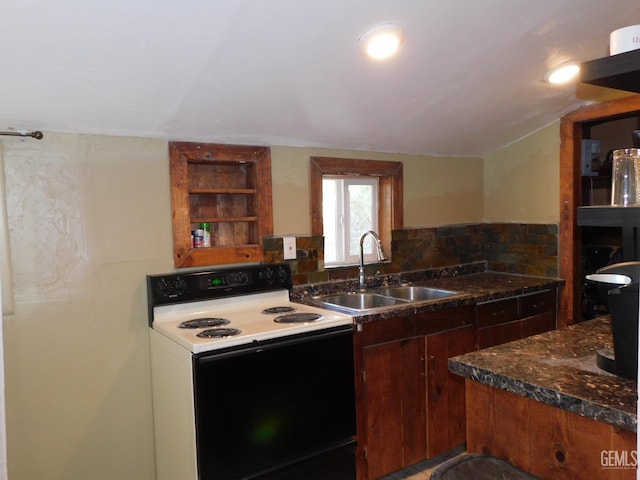 kitchen featuring white electric range oven, sink, and vaulted ceiling