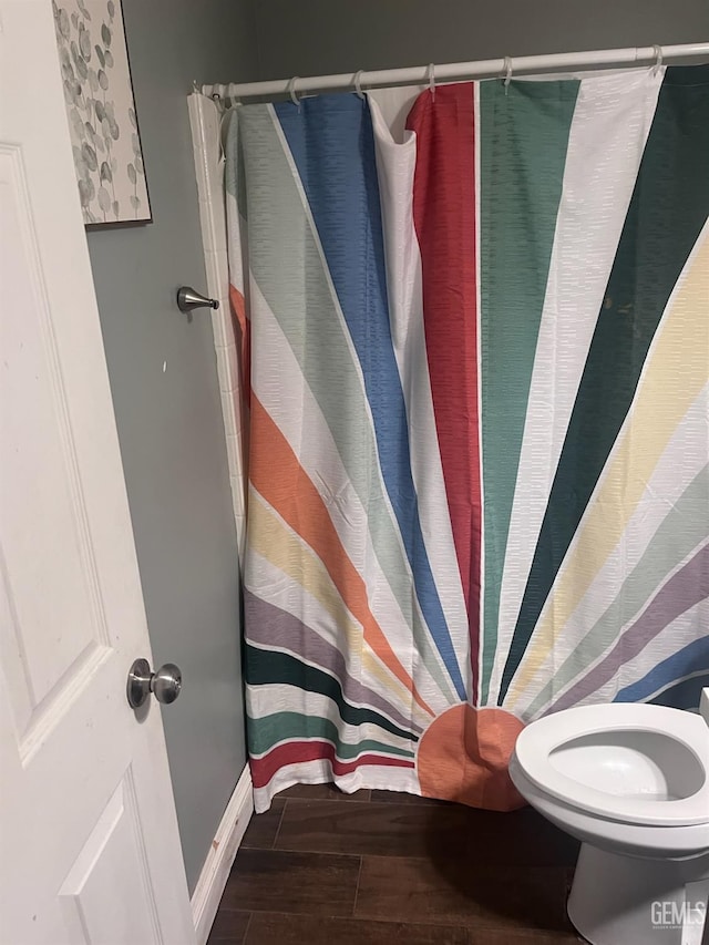 6009 Georgia Pine Way, Bakersfield, CA 93313 - full bathroom featuring wood finished floors and a shower with curtain
