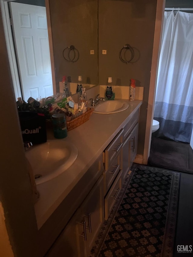 6009 Georgia Pine Way, Bakersfield, CA 93313 - bathroom with double vanity and toilet