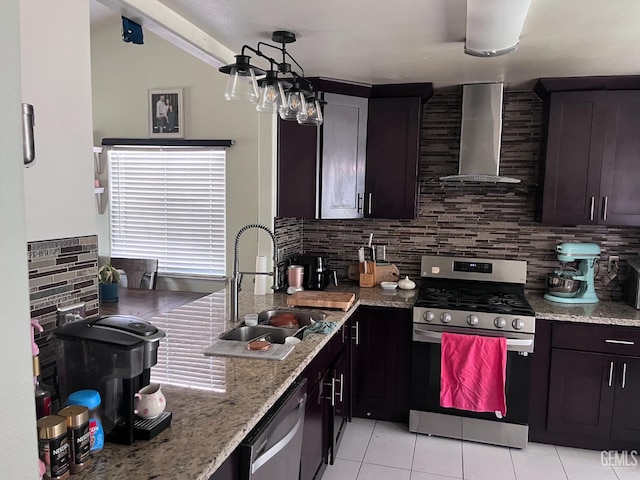 6009 Georgia Pine Way, Bakersfield, CA 93313 - kitchen featuring wall chimney range hood, appliances with stainless steel finishes, light tile patterned floors, and tasteful backsplash