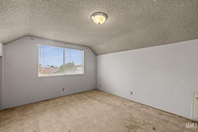 bonus room featuring carpet floors, a textured ceiling, and vaulted ceiling