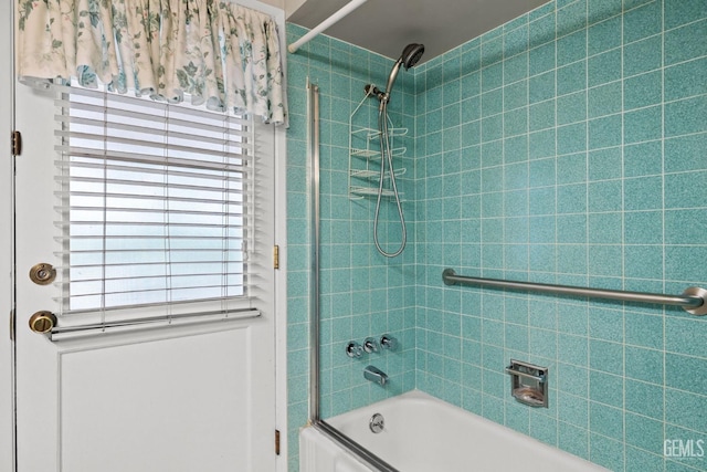 full bathroom featuring bath / shower combo with glass door