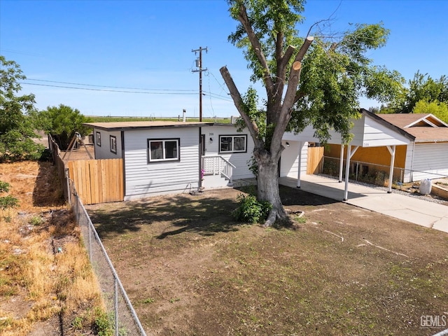 single story home featuring fence and driveway