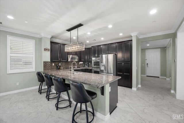 28537 Vista Del Rio Dr, Valencia, CA 91354 - kitchen featuring appliances with stainless steel finishes, stone countertops, a kitchen breakfast bar, light marble finish floors, and backsplash