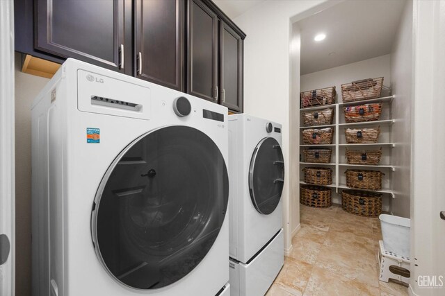 28537 Vista Del Rio Dr, Valencia, CA 91354 - laundry room with cabinet space and washer and clothes dryer