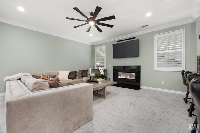 28537 Vista Del Rio Dr, Valencia, CA 91354 - living room with a ceiling fan, a glass covered fireplace, light marble finish flooring, crown molding, and recessed lighting