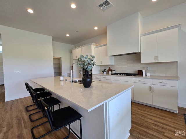 12110 Pendulum Dr, Bakersfield, CA 93306 - kitchen featuring tasteful backsplash, visible vents, gas stovetop, and dark wood-type flooring