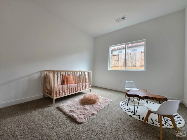 unfurnished bedroom featuring visible vents, carpet flooring, and baseboards