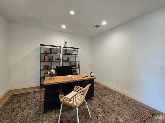 office with visible vents, recessed lighting, baseboards, and wood finished floors