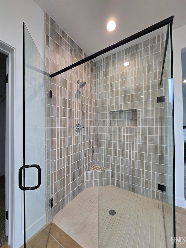 full bathroom featuring a shower stall