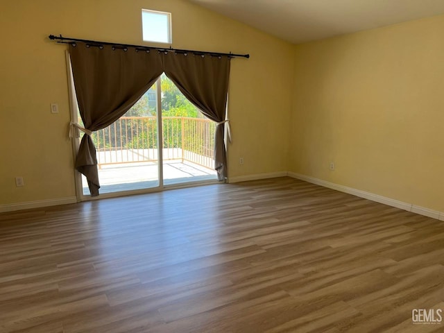 7412 Indian Gulch St, Bakersfield, CA 93313 - unfurnished room with wood finished floors and vaulted ceiling
