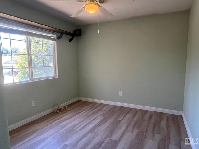 7412 Indian Gulch St, Bakersfield, CA 93313 - unfurnished room featuring wood finished floors and a ceiling fan