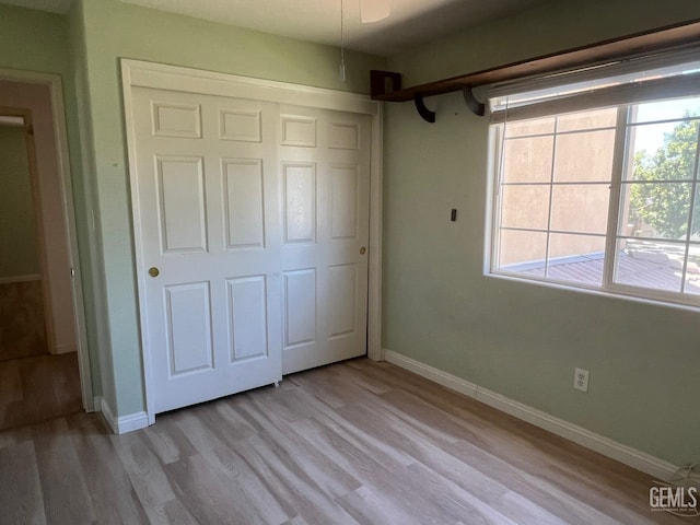7412 Indian Gulch St, Bakersfield, CA 93313 - unfurnished bedroom with light wood-style flooring and a closet