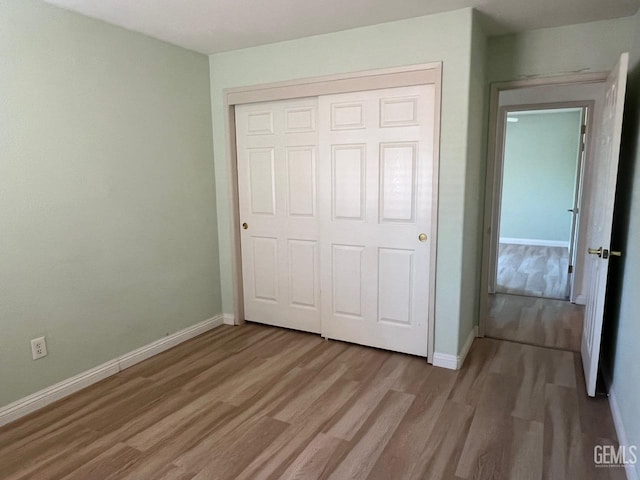 7412 Indian Gulch St, Bakersfield, CA 93313 - unfurnished bedroom featuring light wood finished floors and a closet