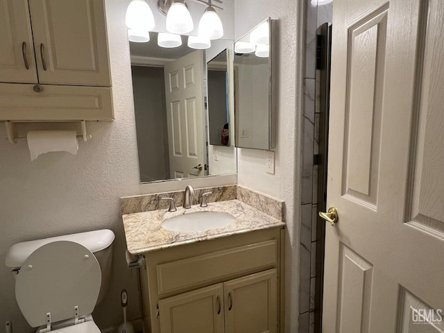 7412 Indian Gulch St, Bakersfield, CA 93313 - half bath featuring vanity and a textured wall