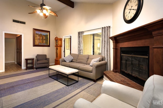 9604 Lea Oak Rd, Bakersfield, CA 93311 - living room with ceiling fan, high vaulted ceiling, baseboards, beam ceiling, and a glass covered fireplace