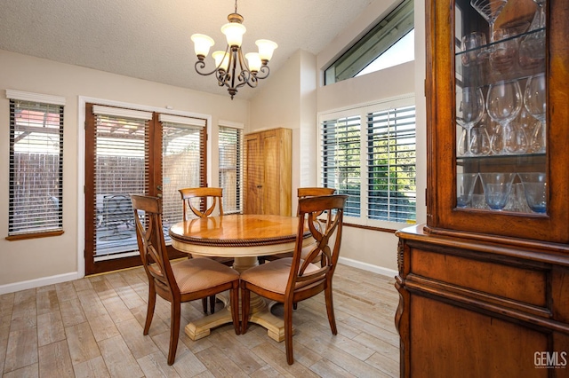 9604 Lea Oak Rd, Bakersfield, CA 93311 - dining space featuring baseboards, a chandelier, healthy amount of natural light, lofted ceiling, and a textured ceiling