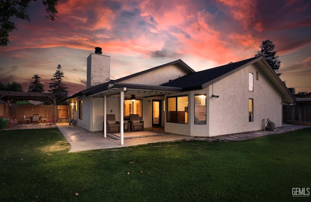 9604 Lea Oak Rd, Bakersfield, CA 93311 - back of house with a chimney, a patio area, and stucco siding