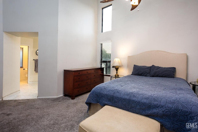 9604 Lea Oak Rd, Bakersfield, CA 93311 - bedroom with a towering ceiling, baseboards, carpet flooring, and ensuite bath