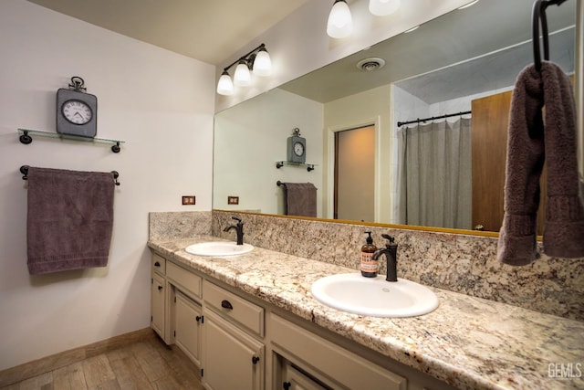 9604 Lea Oak Rd, Bakersfield, CA 93311 - bathroom with wood finished floors, double vanity, baseboards, and a shower with curtain