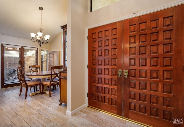 9604 Lea Oak Rd, Bakersfield, CA 93311 - foyer entrance with a chandelier, light wood finished floors, and baseboards