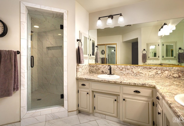 9604 Lea Oak Rd, Bakersfield, CA 93311 - bathroom with marble look tile flooring, double vanity, and a stall shower