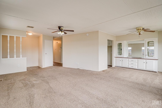 400 E Roberts Ln Unit 48, Bakersfield, CA 93308 - unfurnished living room featuring ceiling fan and carpet flooring
