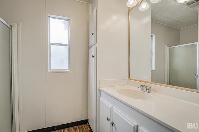400 E Roberts Ln Unit 48, Bakersfield, CA 93308 - full bath with a shower stall, vanity, plenty of natural light, and wood finished floors
