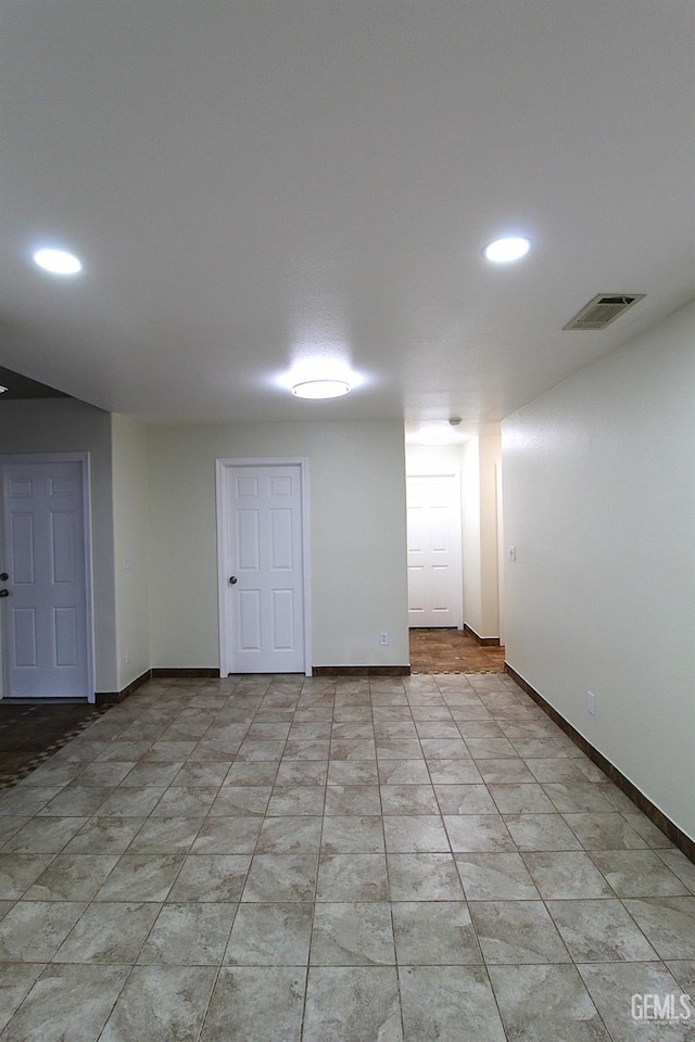 basement featuring recessed lighting, visible vents, and baseboards