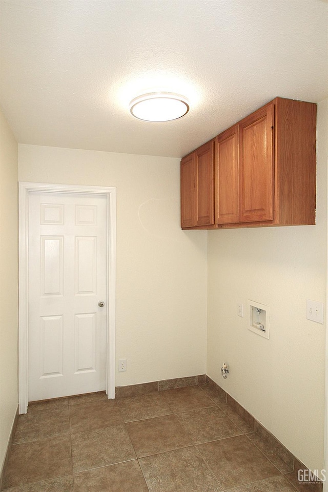 laundry room with hookup for a washing machine and cabinet space
