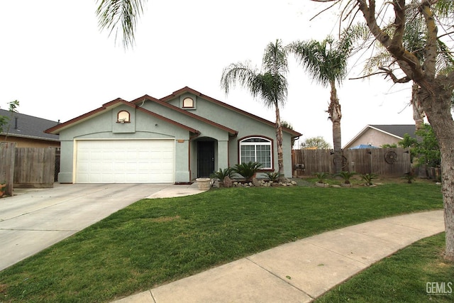 view of front of house featuring an attached garage, fence, driveway, and stucco siding