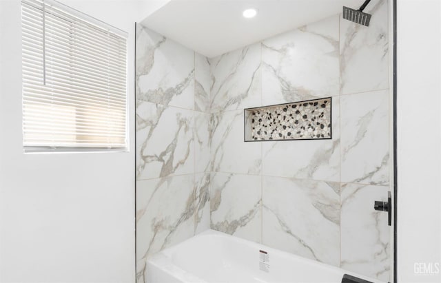 bathroom featuring tiled shower / bath combo