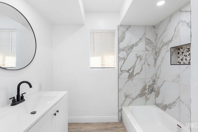 bathroom with hardwood / wood-style floors and vanity