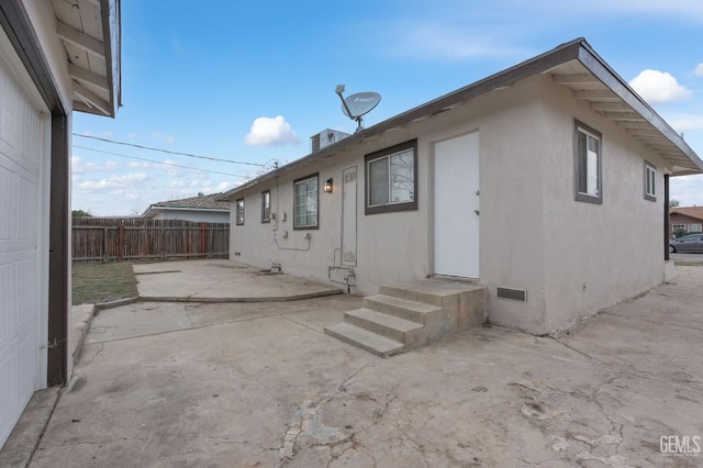 back of house with a patio