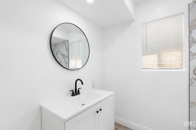 bathroom featuring vanity and hardwood / wood-style flooring