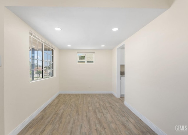 unfurnished room with light wood-type flooring