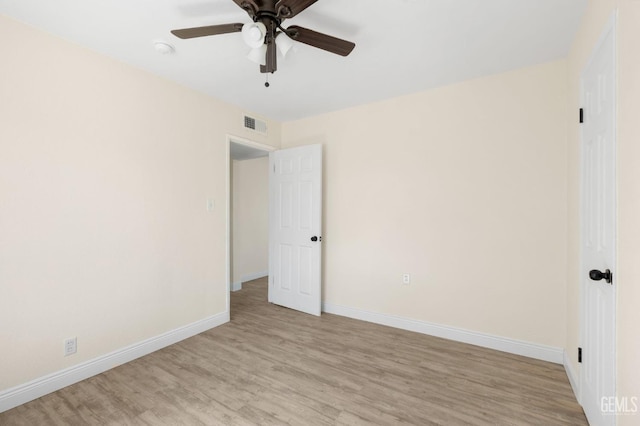 unfurnished room with ceiling fan and light hardwood / wood-style flooring