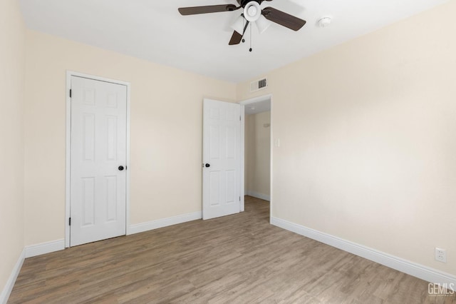 unfurnished bedroom with wood-type flooring and ceiling fan