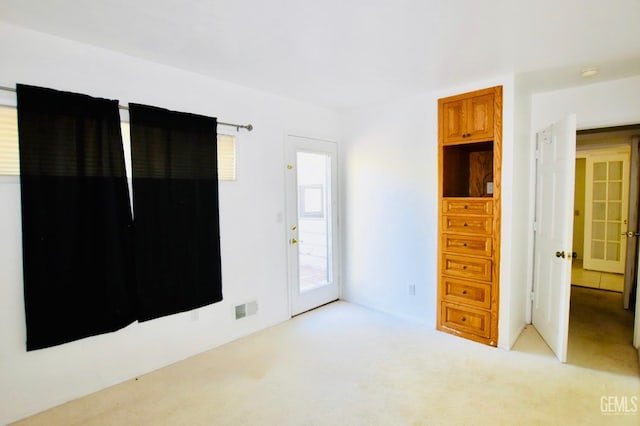 25231 Paramount Dr, Tehachapi, CA 93561 - unfurnished bedroom featuring carpet floors and access to exterior