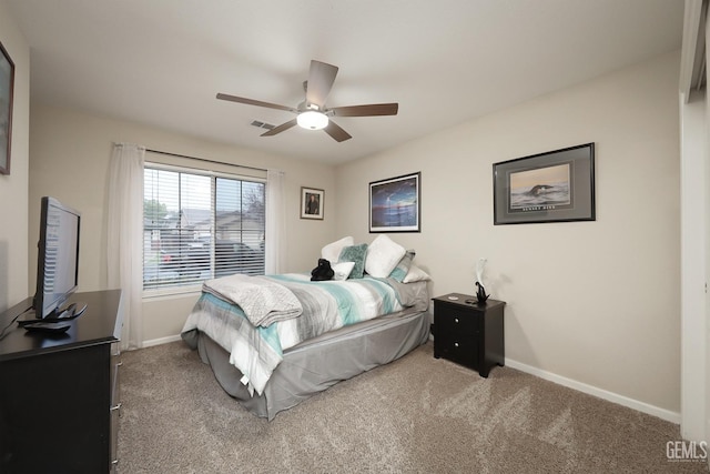 carpeted bedroom featuring a ceiling fan and baseboards