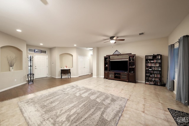 unfurnished living room featuring a ceiling fan, recessed lighting, visible vents, and baseboards