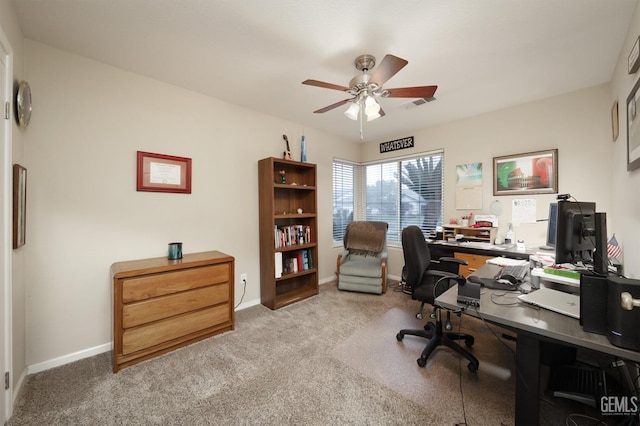 carpeted home office featuring visible vents, ceiling fan, and baseboards