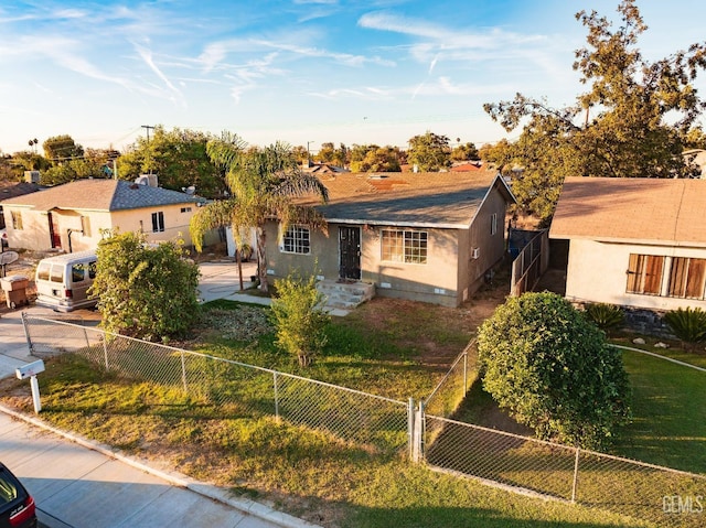 ranch-style home featuring a front yard