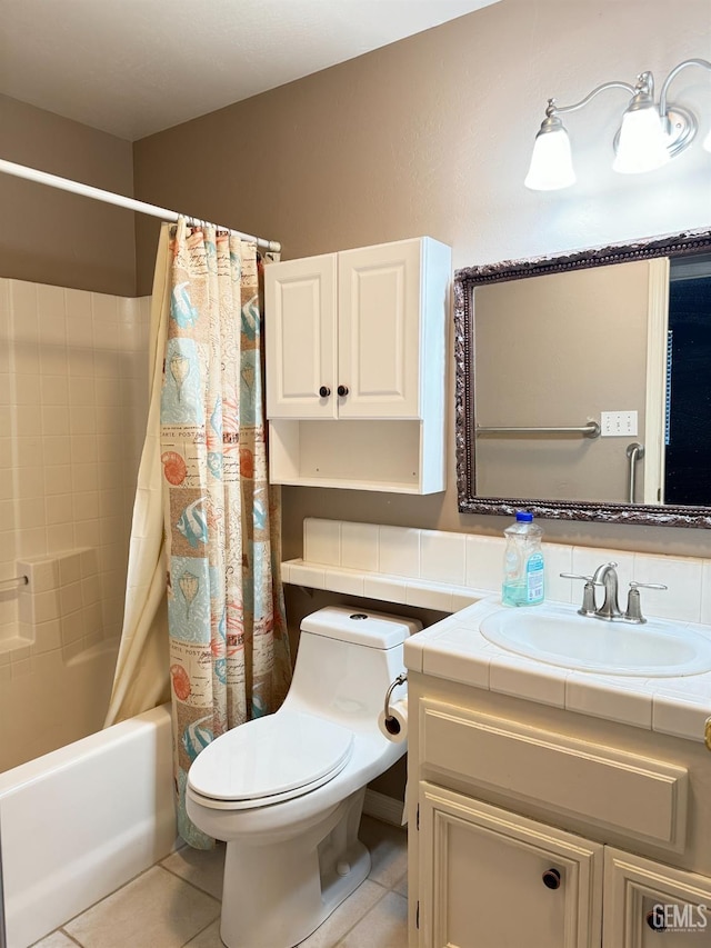 full bath featuring toilet, vanity, tile patterned flooring, and shower / bath combo with shower curtain