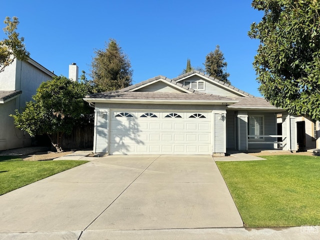 single story home with a garage, driveway, a front lawn, and a tiled roof